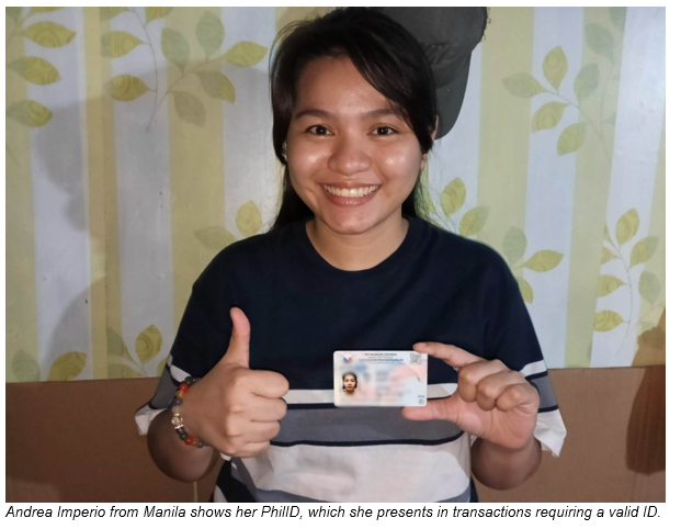 Andrea Imperio from Manila shows her PhilID, which she presents in transactions requiring a valid ID.