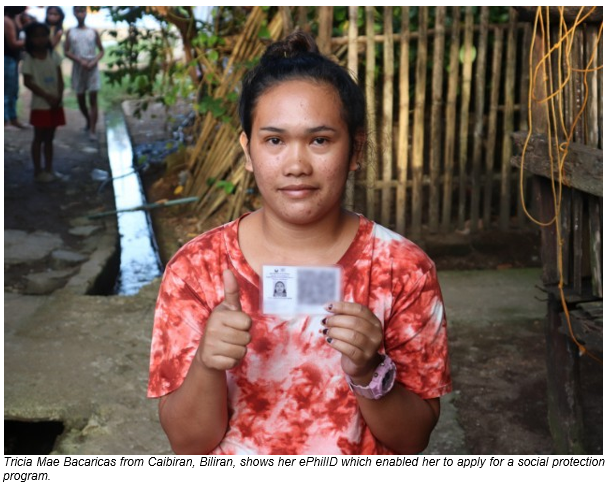 Tricia Mae Bacaricas from Caibiran, Biliran, shows her ePhilID which enabled her to apply for a social protection program.
