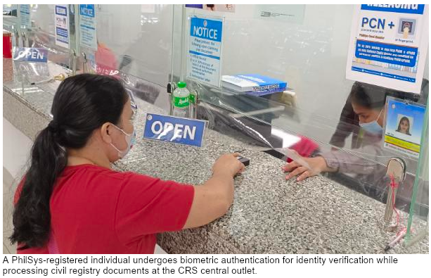 A PhilSys-registered individual undergoes biometric authentication for identity verification while processing civil registry documents at the CRS central outlet.